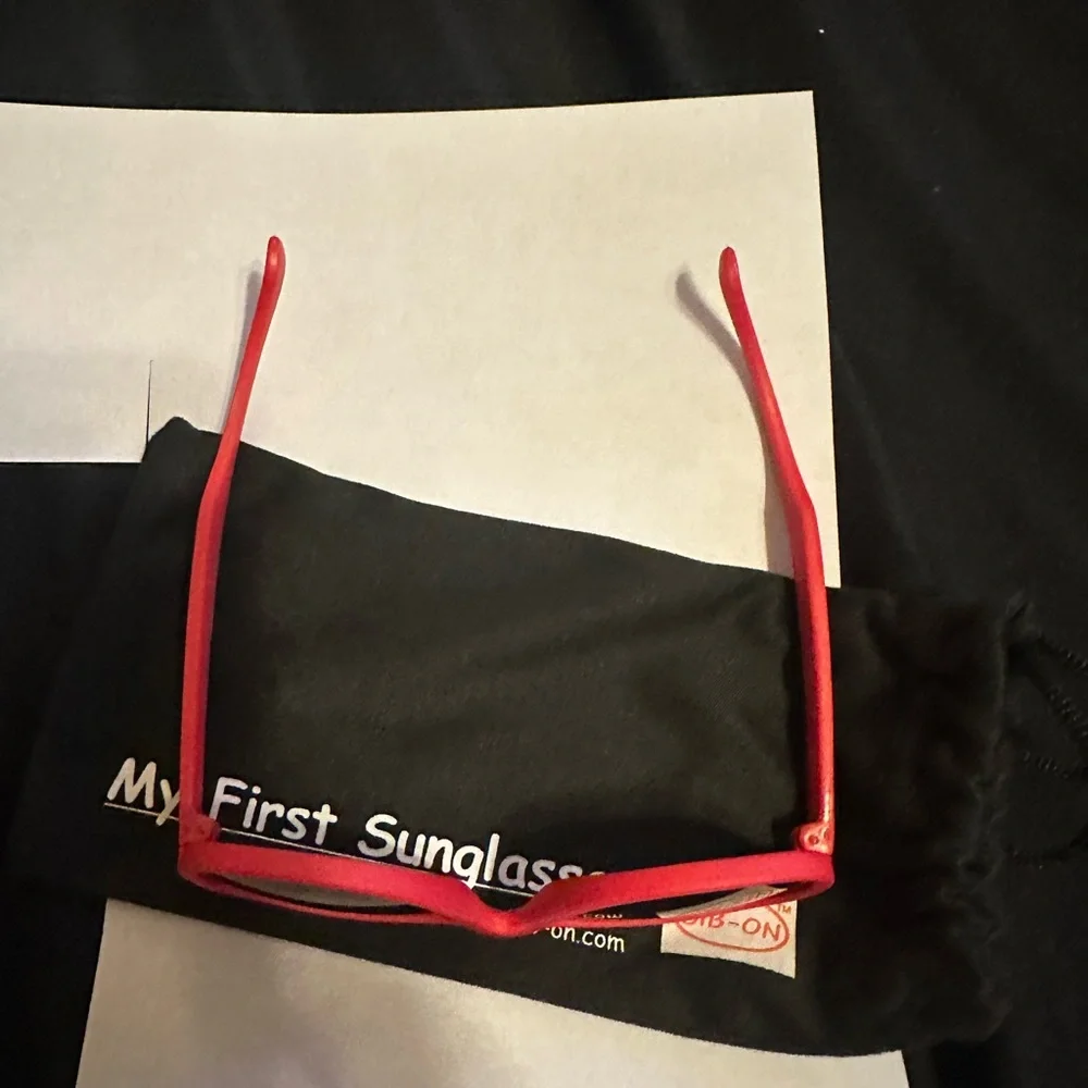 Vibrant Red Sunglasses with Dark Lenses for babies.